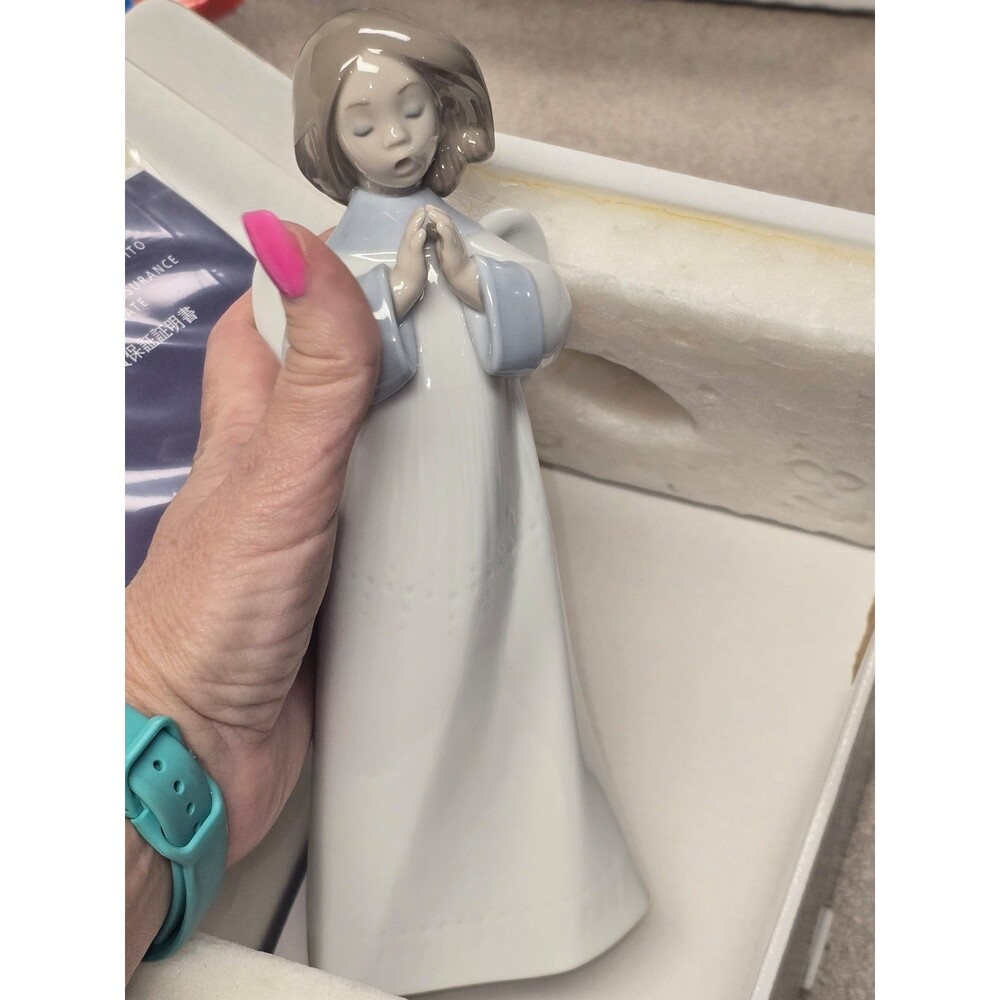 Lladro figurine titled "An Angel's Song" in box
